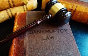 bankruptcy law book with gavel on top